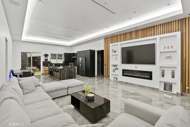 a kitchen with a sink cabinets and wooden floor