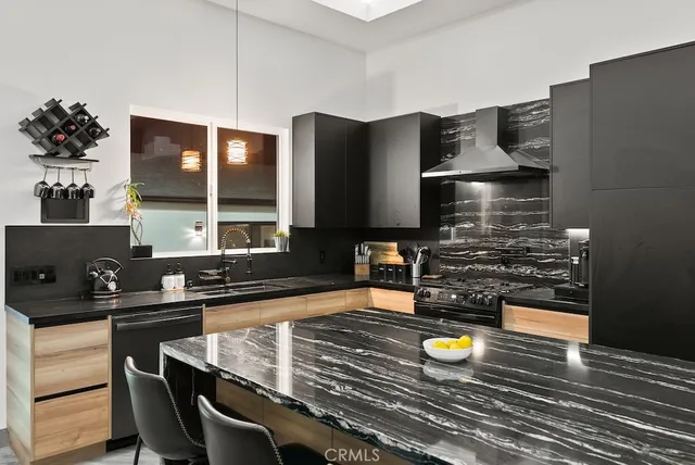 a kitchen with stainless steel appliances granite countertop lots of counter top space