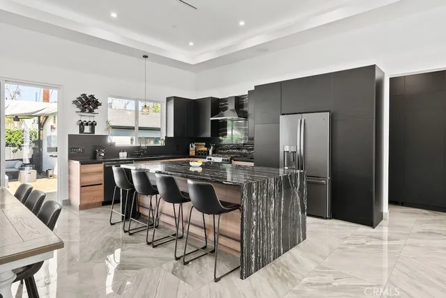 a spacious bedroom with a bed and a view of bathroom