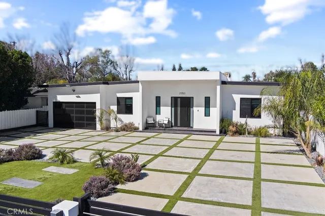 a front view of a house with yard