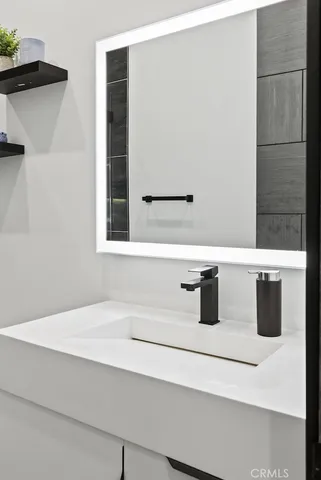 a bedroom with a bed and a table