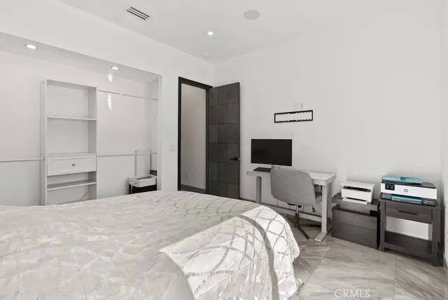 a bathroom with a glass shower door