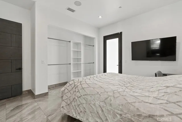 a view of a chairs and table in the patio with a fire pit