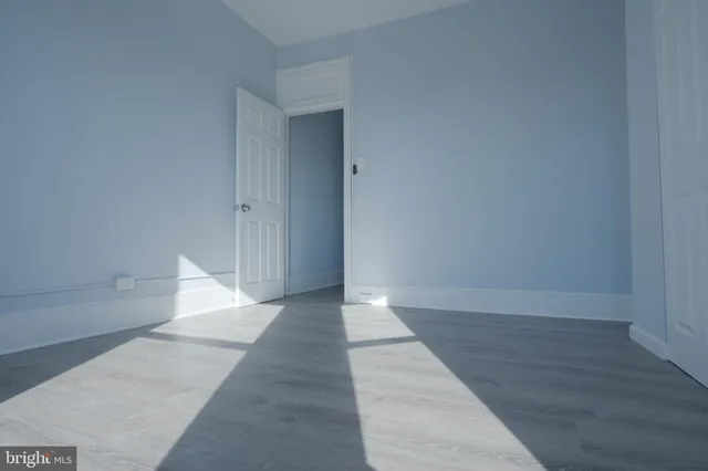 wooden floor in a hall with an entryway