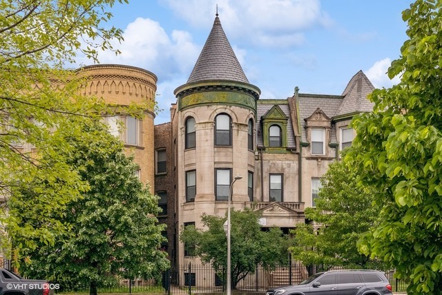 4740 South Prairie Avenue, Unit G Chicago, IL 60615 - Photo 1 of 9 a view of a brick building with large windows