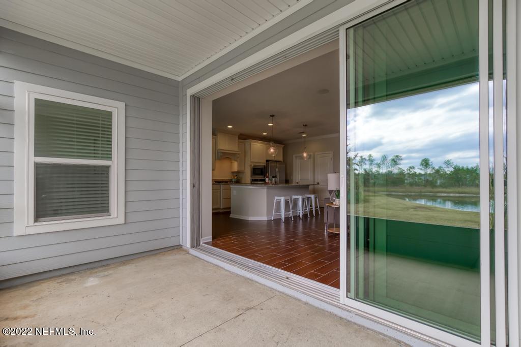 9802 Kevin Road Jacksonville, FL 32257 - Photo 19 of 22 a view of a glass door and an outdoor space