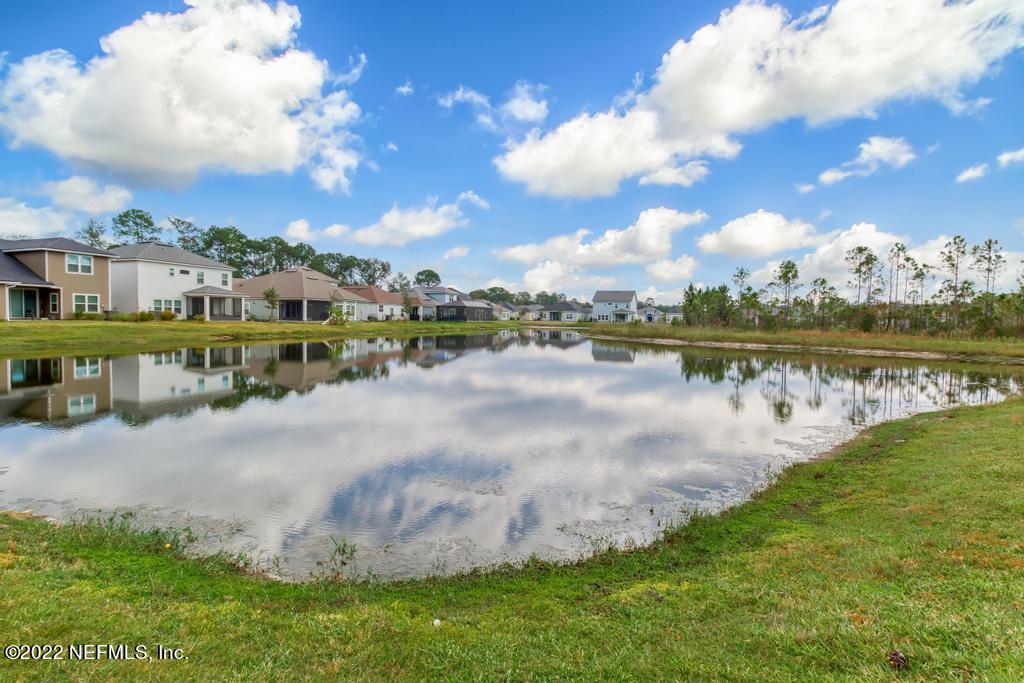 9802 Kevin Road Jacksonville, FL 32257 - Photo 21 of 22 a view of a lake with houses in the back