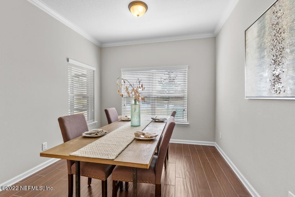 9802 Kevin Road Jacksonville, FL 32257 - Photo 9 of 22 a view of a dining room with furniture window and outside view