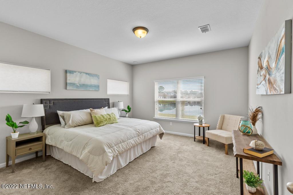 9802 Kevin Road Jacksonville, FL 32257 - Photo 10 of 22 a bedroom with a bed and a window