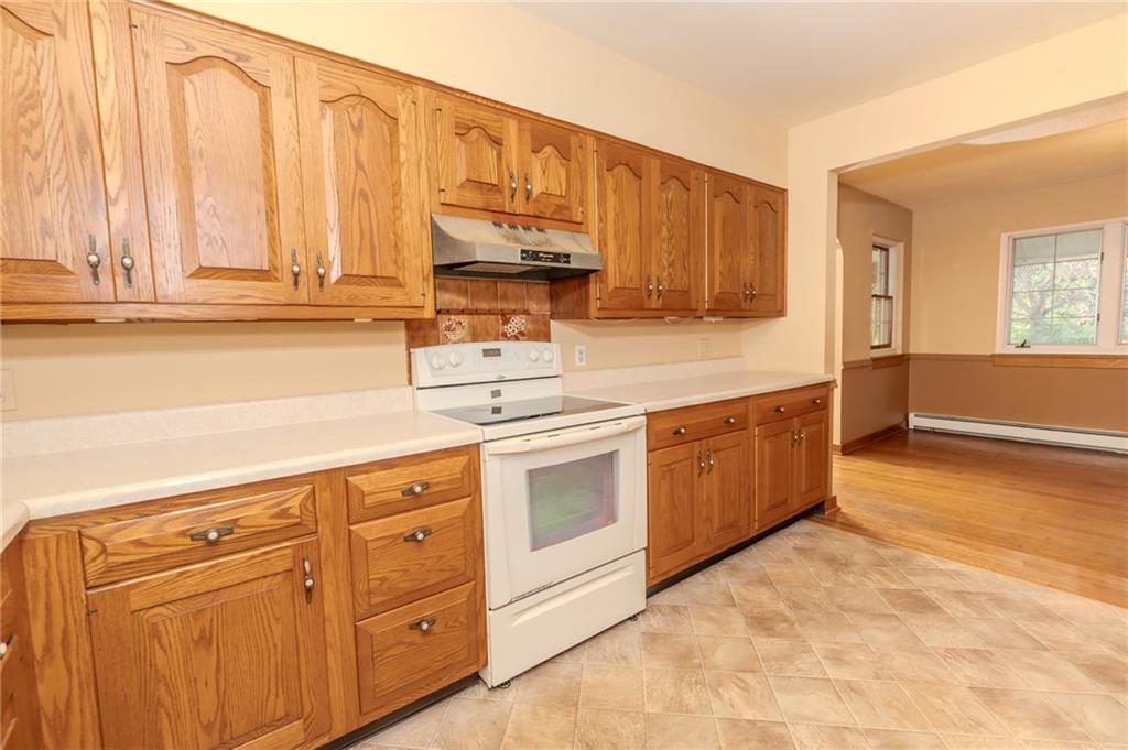 667 East Pike Road Indiana, PA 15701 - Photo 11 of 35 a kitchen with stainless steel appliances granite countertop a stove a sink and a refrigerator