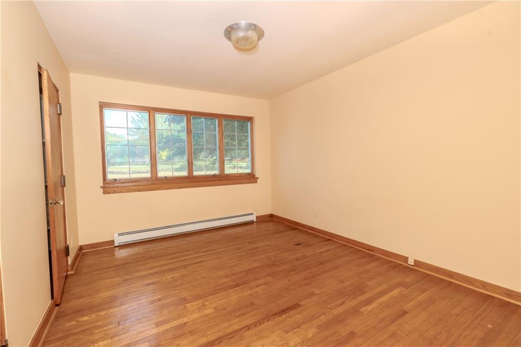 667 East Pike Road Indiana, PA 15701 - Photo 15 of 35 an empty room with wooden floor and windows