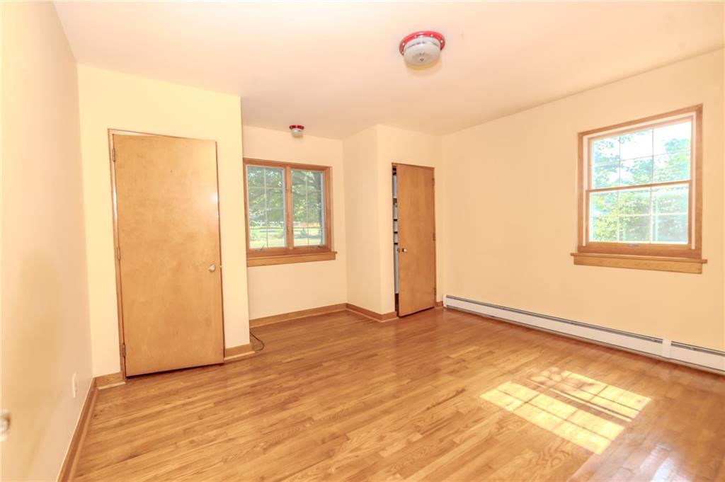 667 East Pike Road Indiana, PA 15701 - Photo 17 of 35 a view of an empty room with wooden floor and a window