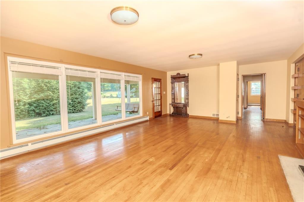 667 East Pike Road Indiana, PA 15701 - Photo 3 of 35 a view of empty room with wooden floor and fan