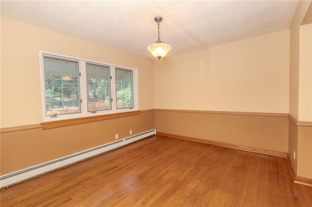 667 East Pike Road Indiana, PA 15701 - Photo 8 of 35 an empty room with wooden floor and windows