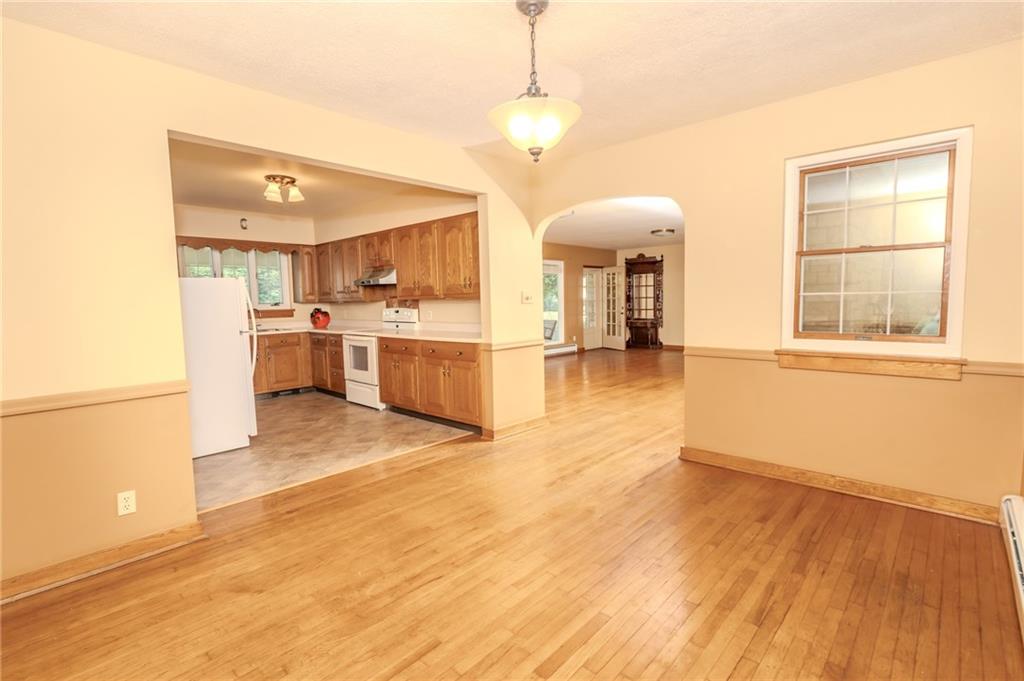 667 East Pike Road Indiana, PA 15701 - Photo 9 of 35 a view of a living room a stove and wooden floor