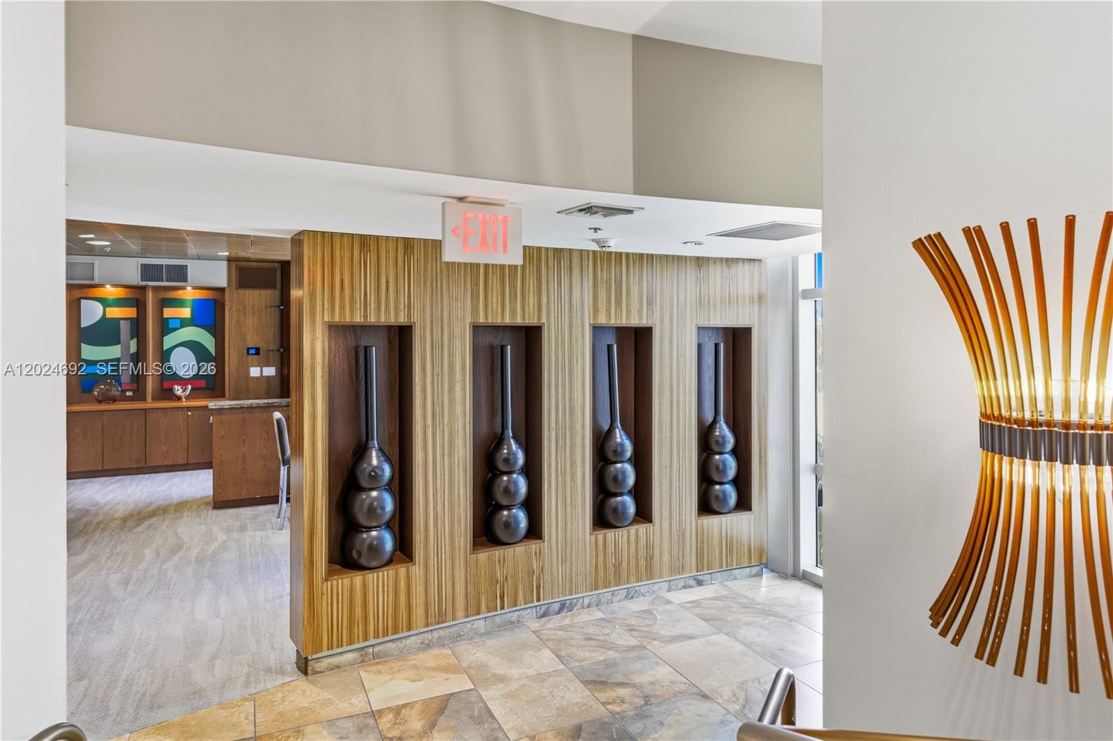 2641 North Flamingo Road, Unit 2605N Sunrise, FL 33323 - Photo 29 of 56 a view of a hallway with furniture and entryway