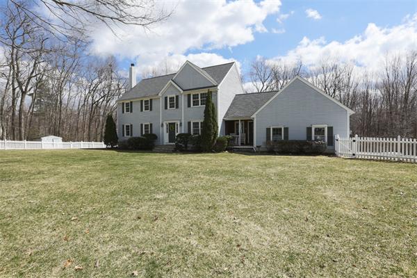 131 Harvard Road Bolton, MA 01740 - Photo 1 of 30 a front view of a house with a yard