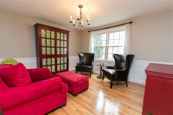 131 Harvard Road Bolton, MA 01740 - Photo 13 of 30 a living room with furniture a chandelier and a window