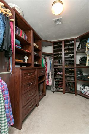 131 Harvard Road Bolton, MA 01740 - Photo 18 of 30 a view of walk in closet with clothes and shoes