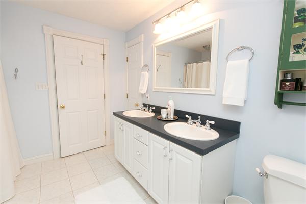 131 Harvard Road Bolton, MA 01740 - Photo 19 of 30 a bathroom with a granite countertop sink and a mirror