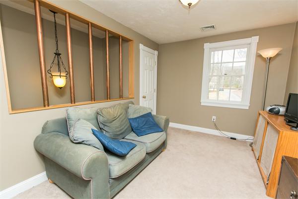 131 Harvard Road Bolton, MA 01740 - Photo 25 of 30 a living room with furniture and a window