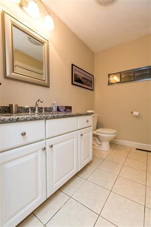131 Harvard Road Bolton, MA 01740 - Photo 26 of 30 a bathroom with a toilet a sink a mirror and vanity