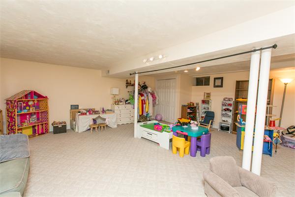 131 Harvard Road Bolton, MA 01740 - Photo 27 of 30 a children room with toys and a couch
