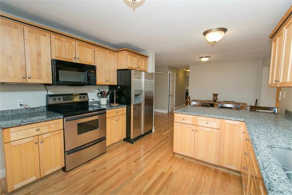 131 Harvard Road Bolton, MA 01740 - Photo 3 of 30 a kitchen with stainless steel appliances granite countertop a stove a sink and a refrigerator