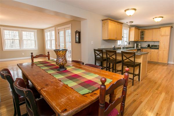 131 Harvard Road Bolton, MA 01740 - Photo 5 of 30 a view of a dining room with furniture and wooden floor