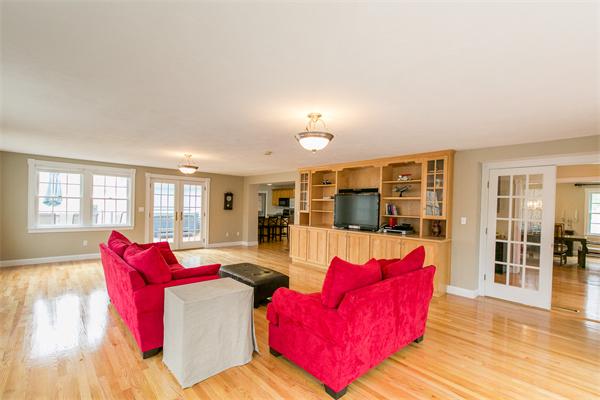 131 Harvard Road Bolton, MA 01740 - Photo 6 of 30 a living room with furniture and floor to ceiling windows