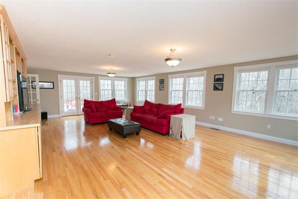 131 Harvard Road Bolton, MA 01740 - Photo 8 of 30 a living room with furniture and a large window