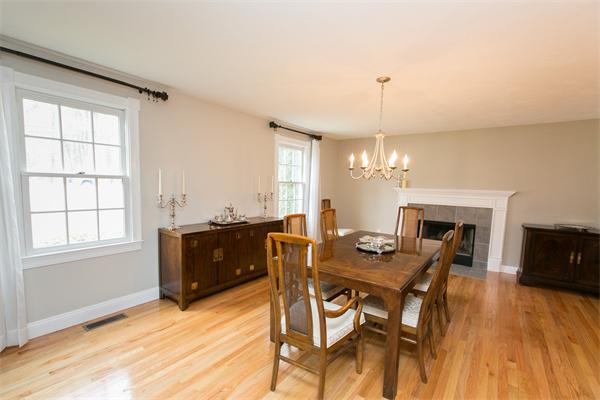 131 Harvard Road Bolton, MA 01740 - Photo 10 of 30 a view of a dining room with furniture window and wooden floor