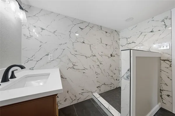 a bathroom with a sink and mirror