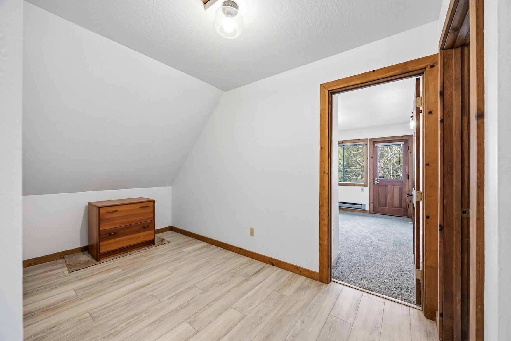 51379 Donner Pass Road Soda Springs, CA 95728 - Photo 16 of 22 an empty room with wooden floor and windows