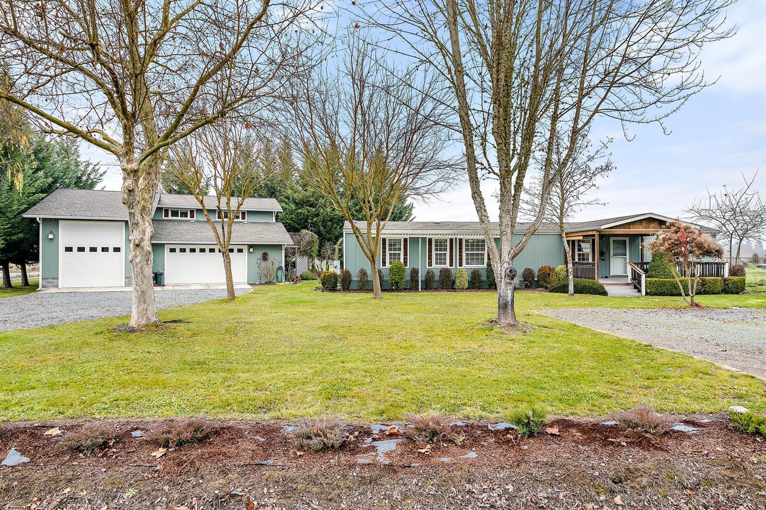 4930 Leonard Road Grants Pass, OR 97527 - Photo 1 of 33 a house with swimming pool in front of it