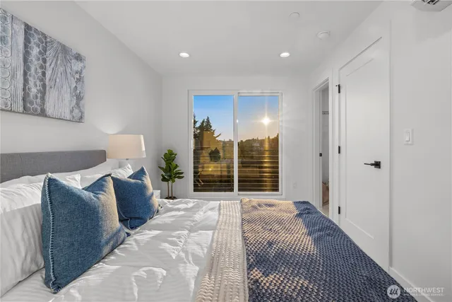 a bed room with a bed and a night stand