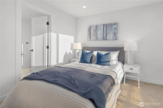 a bathroom with a double vanity sink mirror and shower
