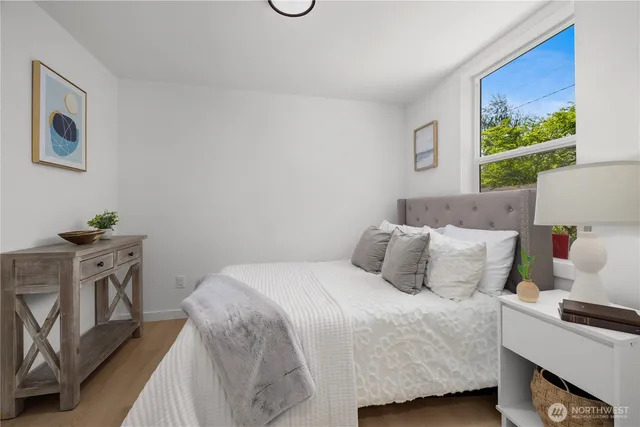 a bedroom with a bed and window