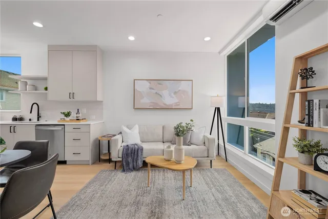 a living room with furniture a rug and a large window