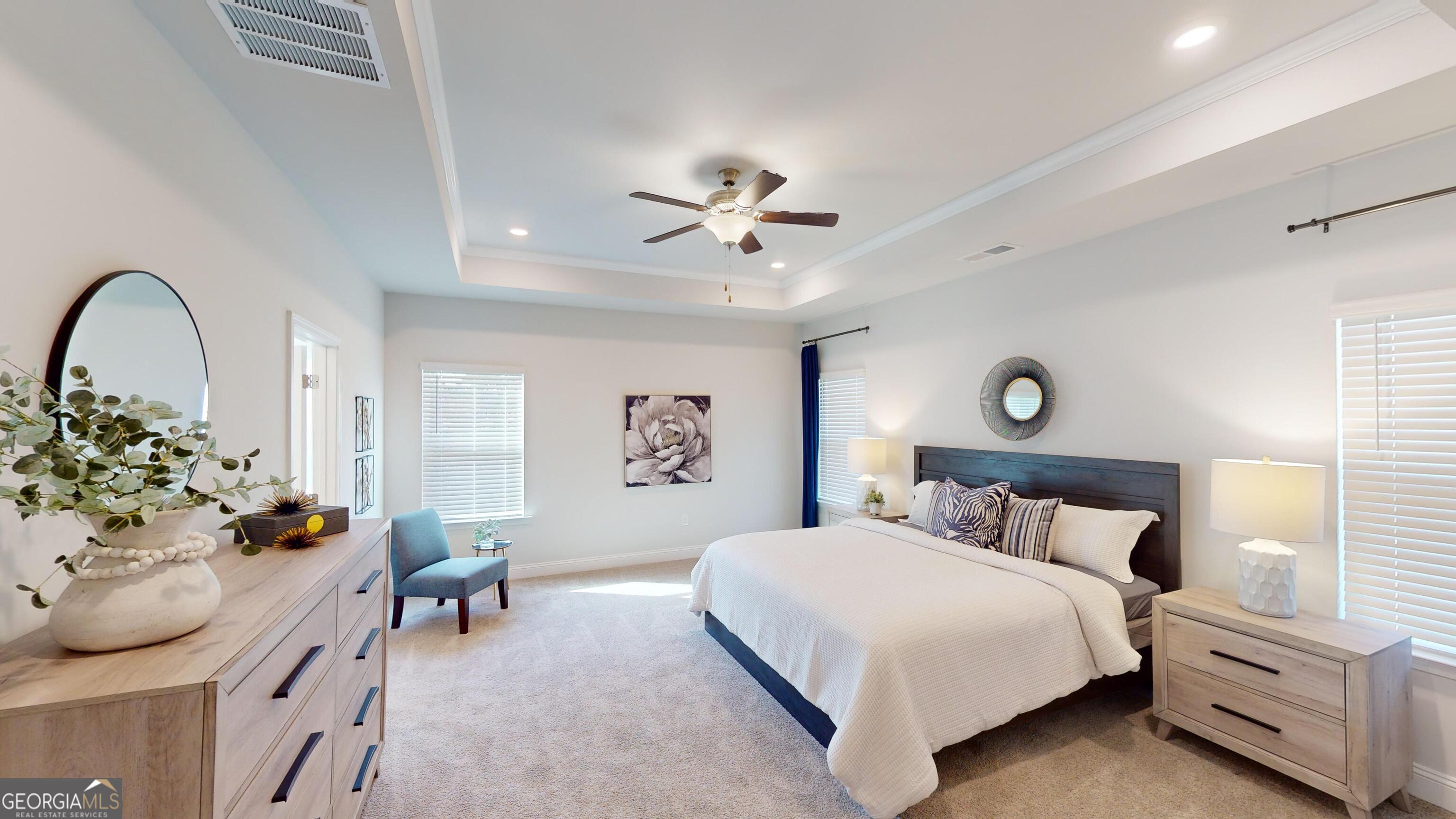 363 Eagle Ridge Road Macon, GA 31216 - Photo 13 of 40 a bedroom with a bed and a chandelier