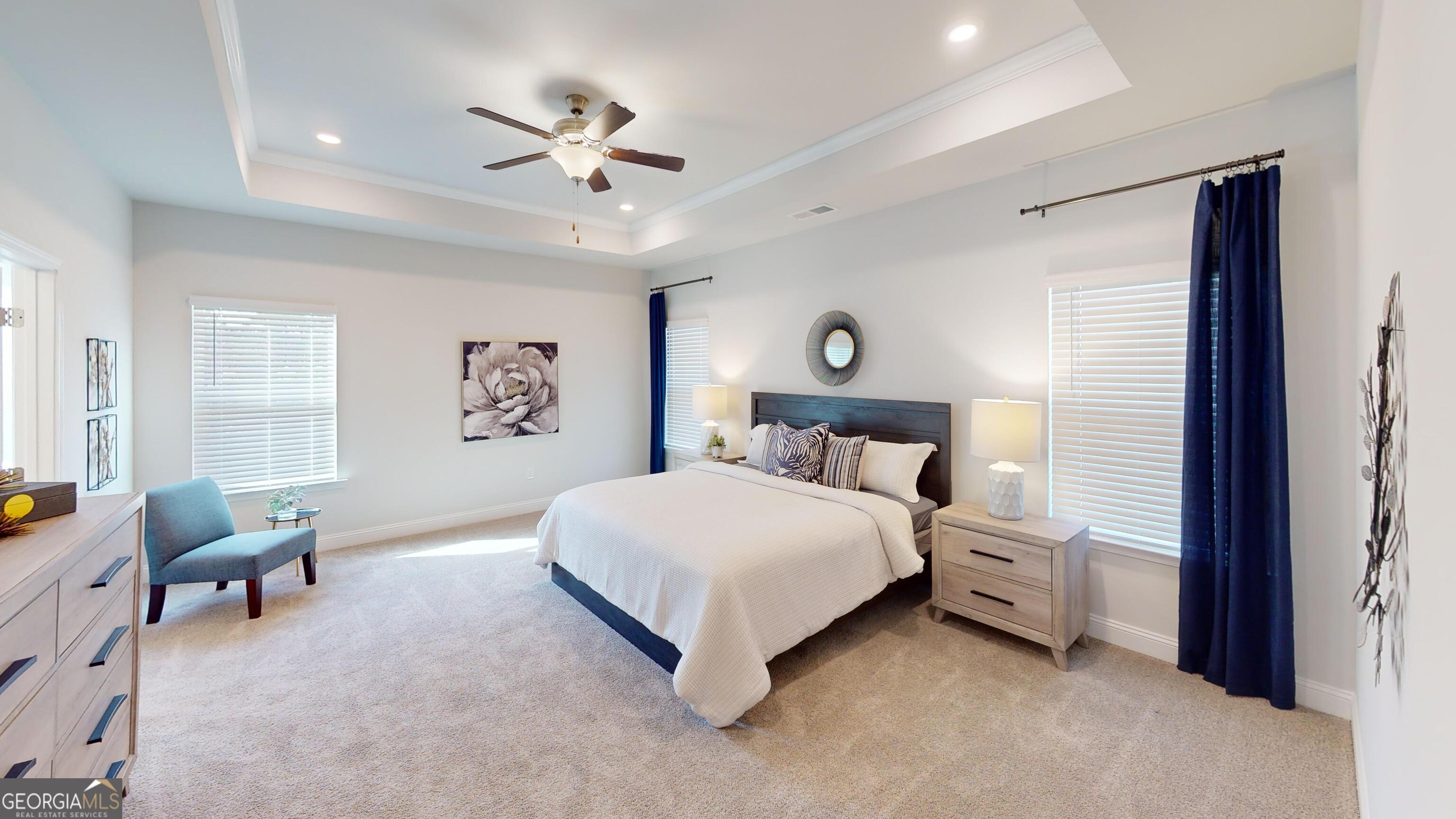 363 Eagle Ridge Road Macon, GA 31216 - Photo 15 of 40 a bedroom with a bed chandelier and a window