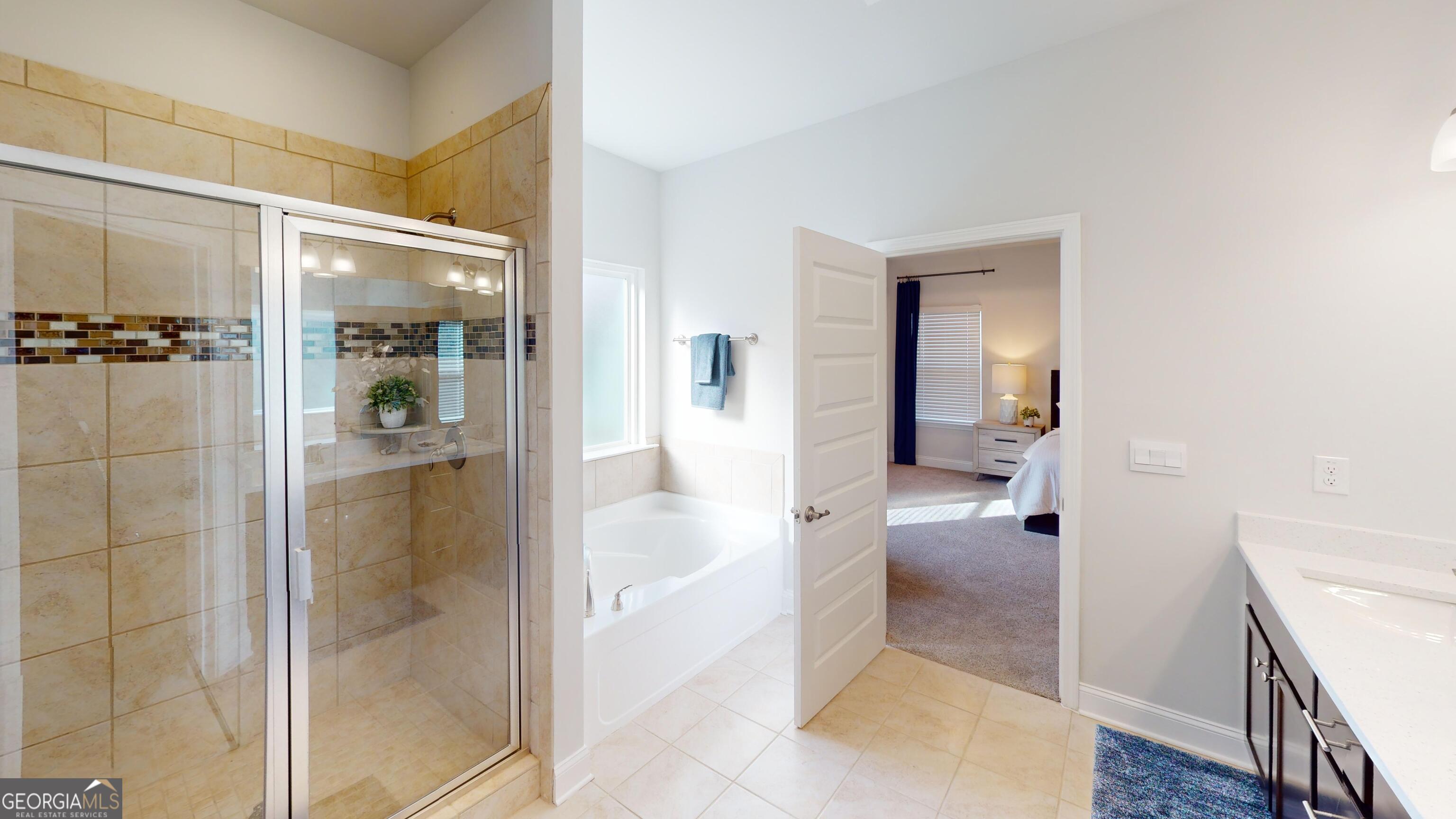 363 Eagle Ridge Road Macon, GA 31216 - Photo 20 of 40 a bathroom with a glass door shower