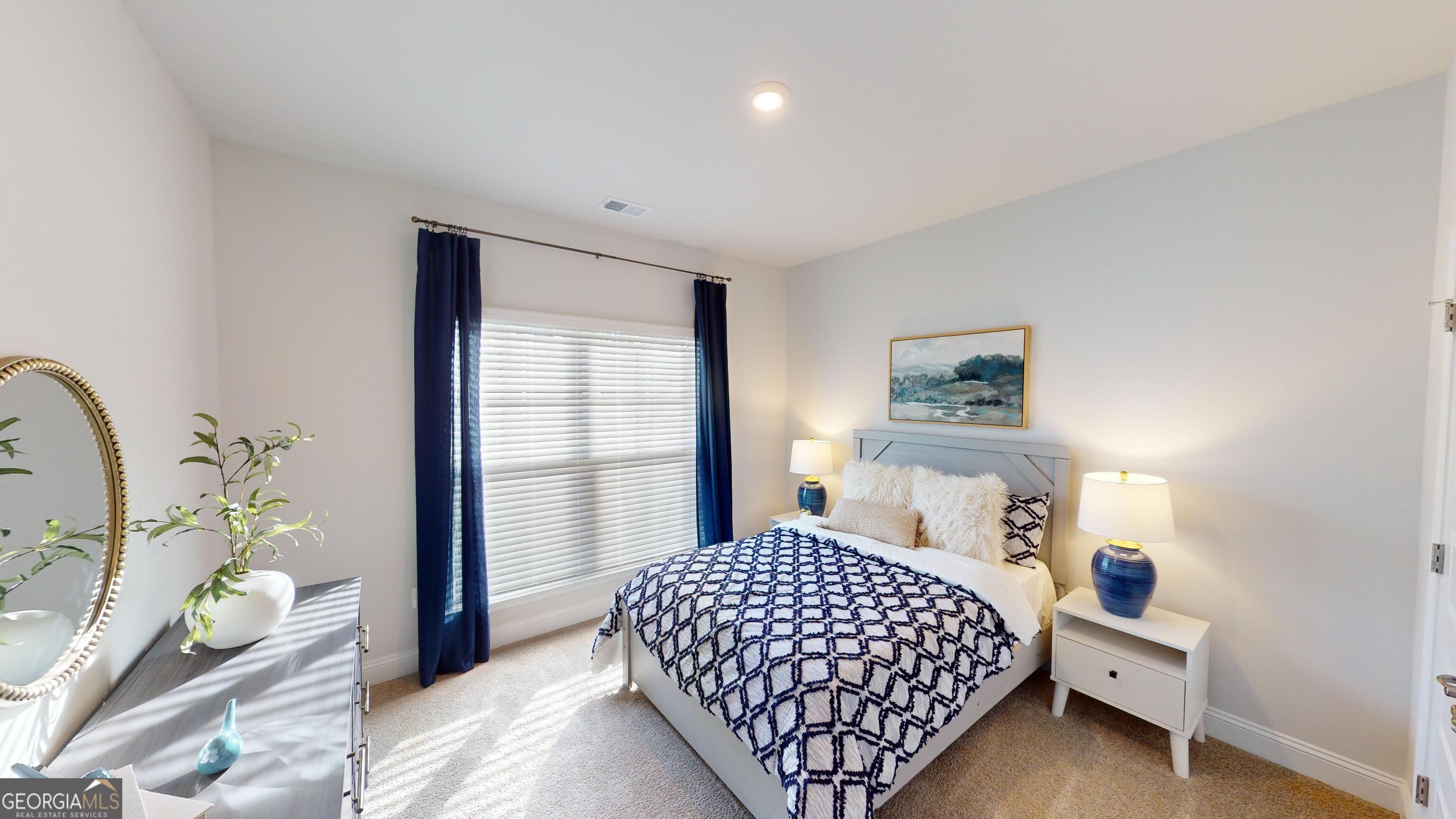 363 Eagle Ridge Road Macon, GA 31216 - Photo 25 of 40 a bedroom with a bed and a window