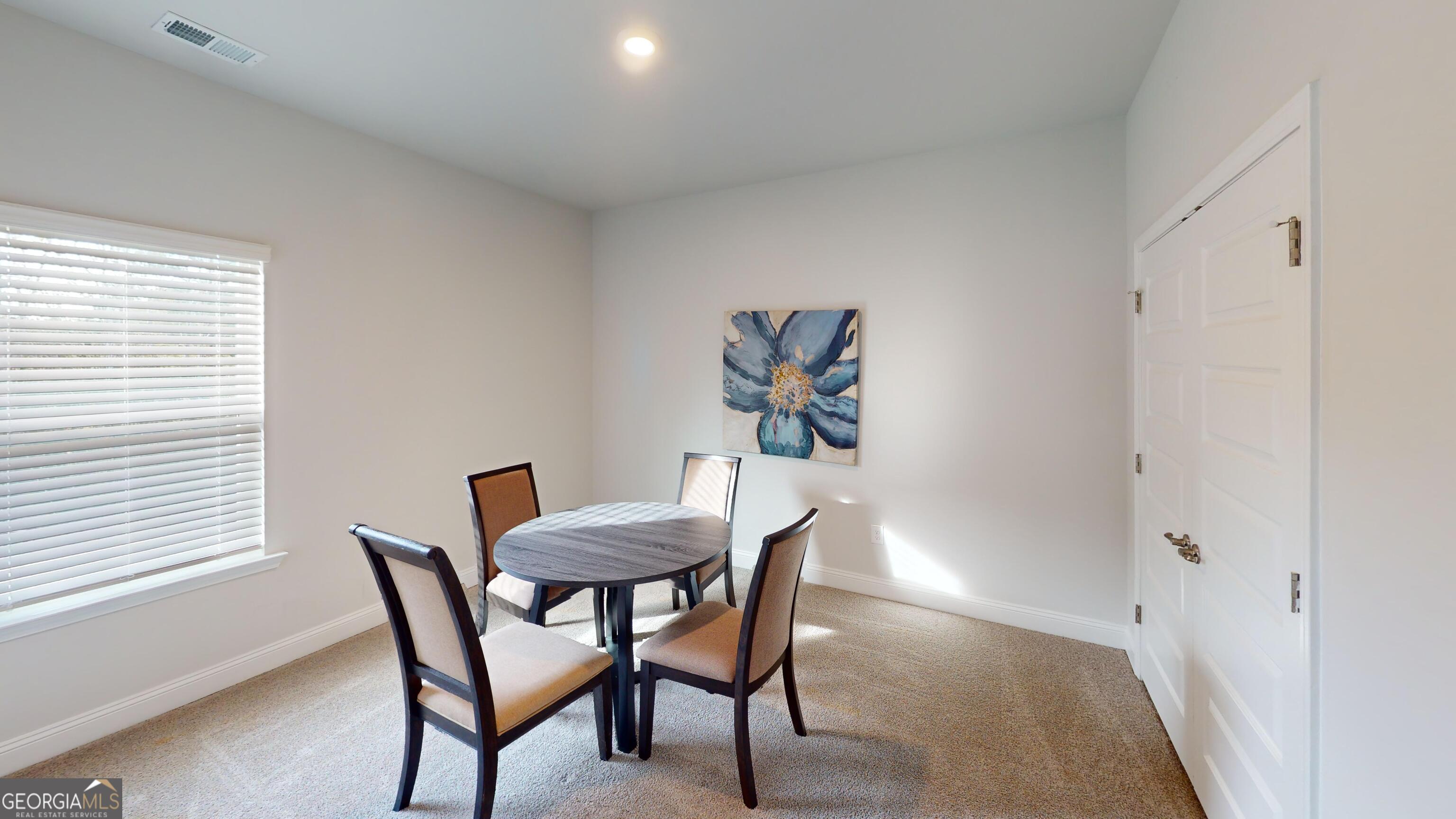363 Eagle Ridge Road Macon, GA 31216 - Photo 28 of 40 a view of a dining room with furniture and window