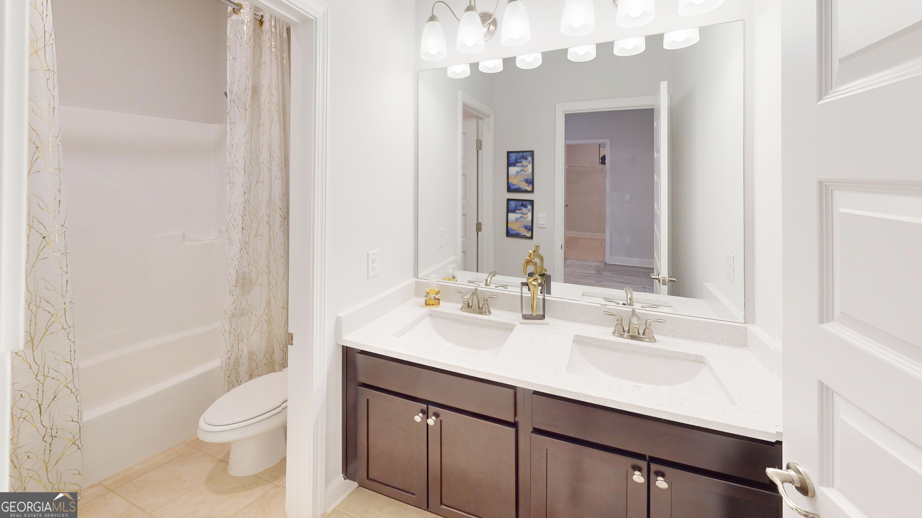 363 Eagle Ridge Road Macon, GA 31216 - Photo 30 of 40 a bathroom with a sink a toilet and shower