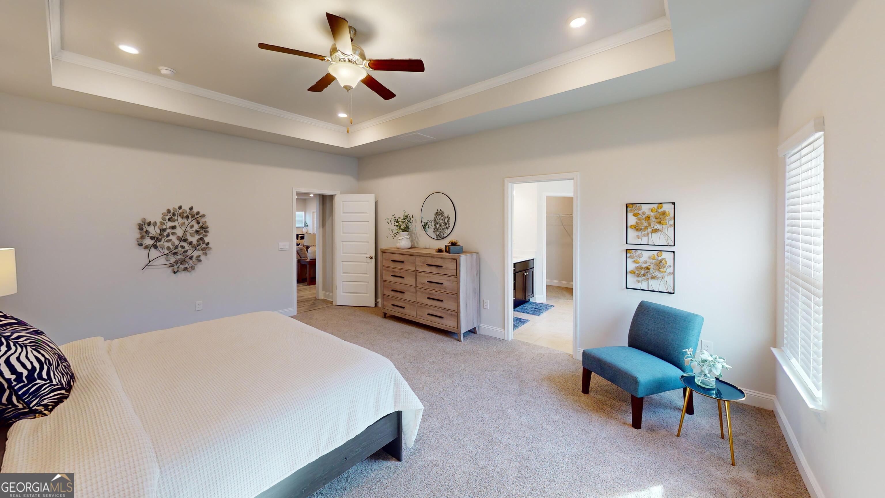 363 Eagle Ridge Road Macon, GA 31216 - Photo 32 of 40 a spacious bedroom with a bed and a chair