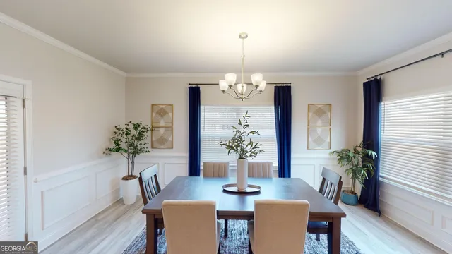 a living room with furniture window and wooden floor