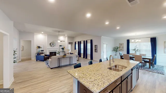 a large kitchen with a table and chairs