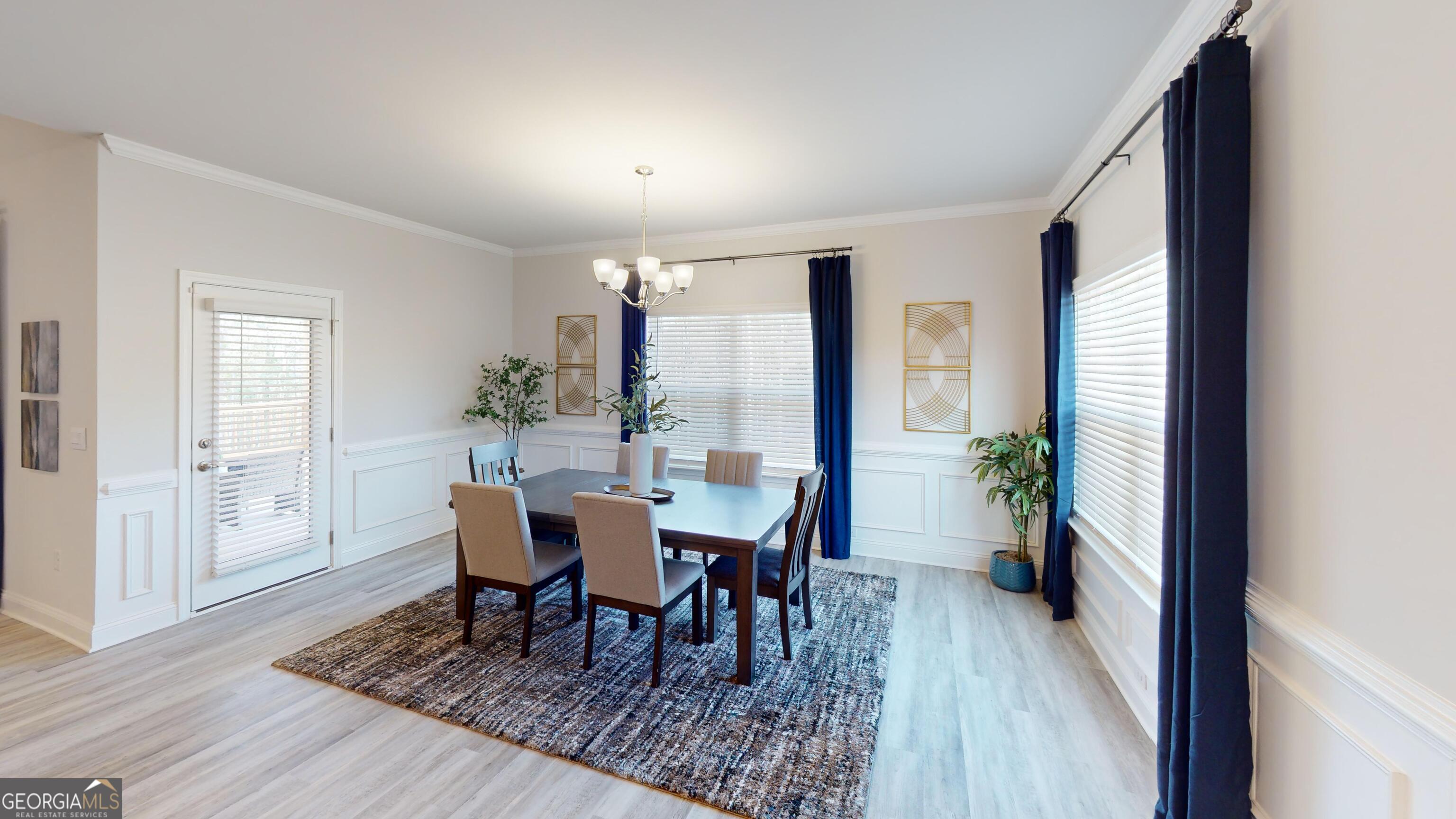 363 Eagle Ridge Road Macon, GA 31216 - Photo 6 of 40 a view of a dining room with furniture and wooden floor