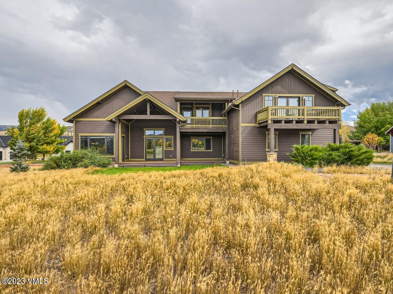 67 Robins Egg Eagle, CO 81631 - Photo 1 of 38 a front view of a house with a yard and garage